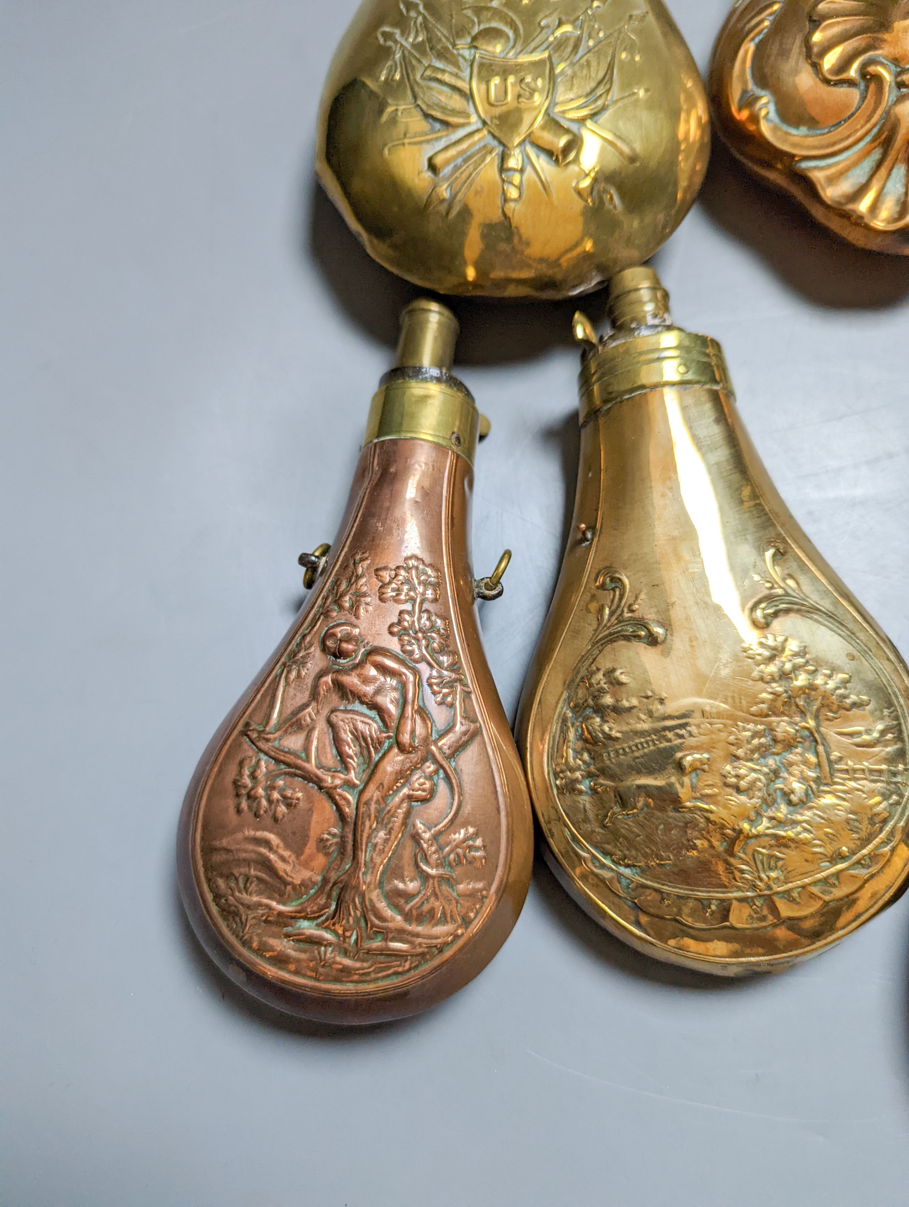 Eight assorted 19th century copper shot flasks